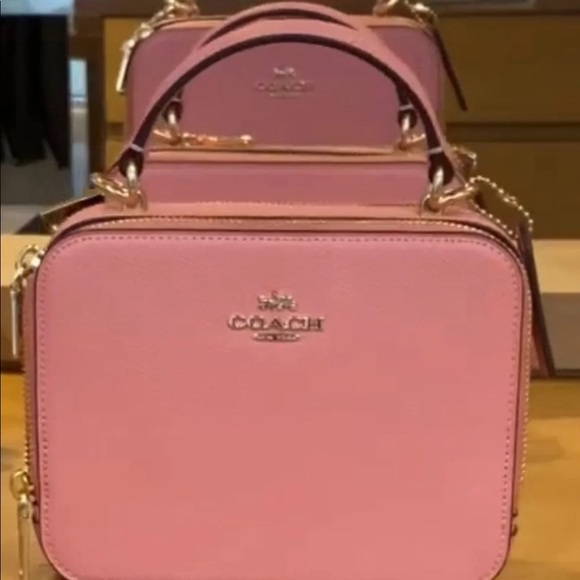 coach box crossbody pink